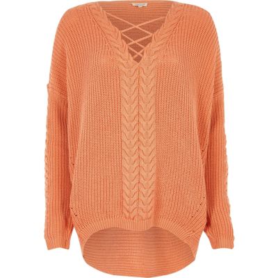 Coral cable knit lace-up front jumper